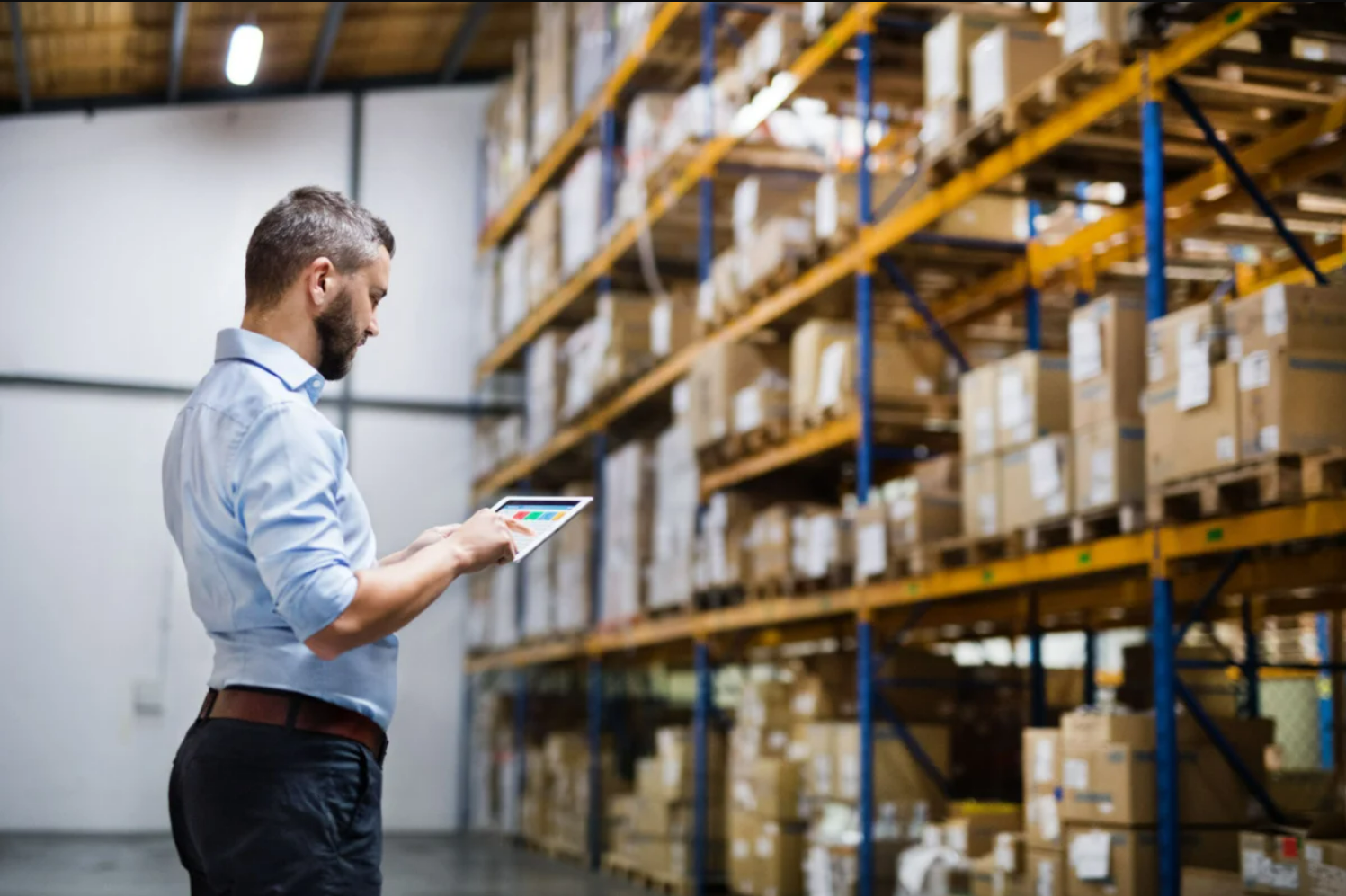Man scanning things in warehouse